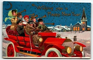Postcard Wishing You a Happy New Year Old Red Car Full of People Blue Sky - Picture 1 of 2