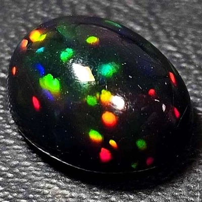 NATURAL AAA+ GALAXYFIRE COLORPLAY OVAL CABOCHAN  ETHIOPIAN WELO BLACKOPAL 1.60CT - Image 1 of 3