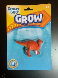 RELOJ JUGUETE DINOSAURIO CORYTHOSAURUS MAGIC GROW ¡CRECE HASTA 600% EN AGUA! NUEVO - Imagen 1 de 2