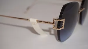 Nuevas gafas de sol Chopard sin montura doradas azules SCHG31 0300 64 16 135 - Imagen 1 de 11