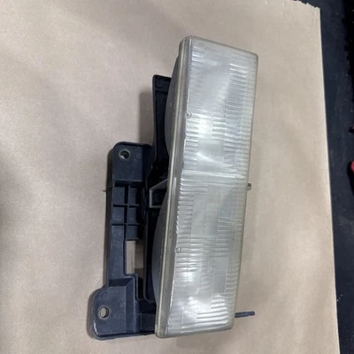 Soporte de lámpara de faro de luz de cabeza izquierda OEM para conductor Chevrolet C1500 montaje ajustador Foto 1 de 4