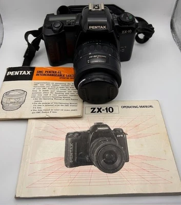 Cámara fotográfica Pentax ZX-10 35 mm SLR con lente SMC Pentax-F 1:4-5,6 35-80 mm con manual Foto 1 de 4