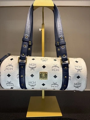 White MCM Monogram Barrel Bag with blue leather trim. - Image 1 of 4