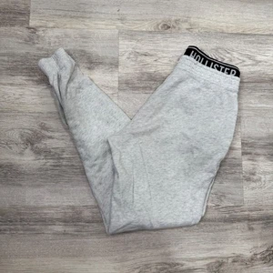 Pantalones deportivos Hollister gris con logotipo cintura talla mediana - Imagen 1 de 10