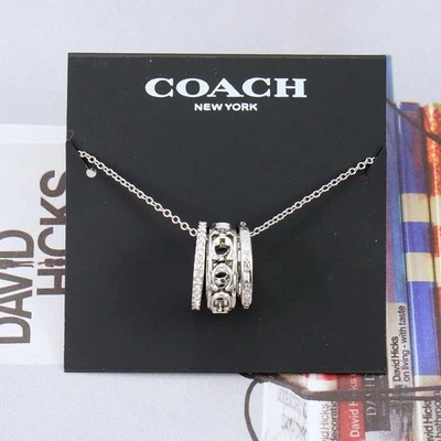 Nuevo con etiquetas Collar Coach Signature Metal Calado Tono Plata Foto 1 de 4