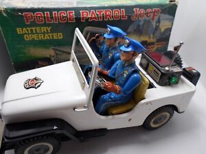 large Police Patrol Jeep b/o tin toy NOMURA Japan with box
