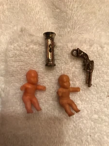 3 MINI GUMBALL PRIZES 2 BABIES 1 FLASHLIGHT AND A PISTOL - Picture 1 of 4