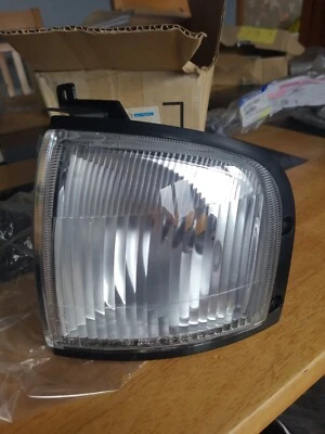 Genuine 1998 Mazda B2500 UH71-51-07XA LENS & BODY(L), F. COMB - Image 1 of 3