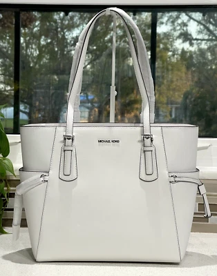 BOLSO DE HOMBRO MICHAEL KORS VOYAGER GRANDE EW PARA PORTÁTIL MK ÓPTICA CUERO BLANCO Foto 1 de 4