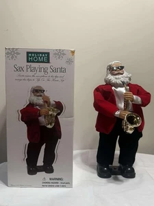Estatuilla de Papá Noel tocando saxo en casa de vacaciones con movimiento y música usada buena - Imagen 1 de 3