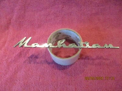 KAISER MANHATTAN GENUINE FACTORY OEM METAL SCRIPT EMBLEM # 792754 FREE SHIPPING - Image 1 of 4