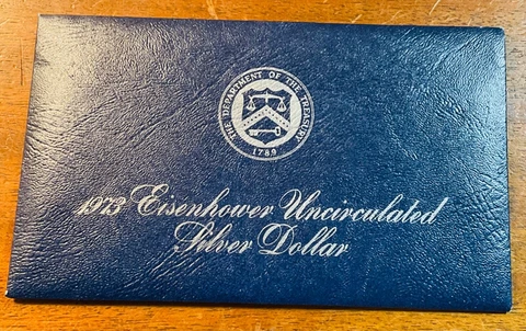One 1973-S Eisenhower blue pack silver uncirculated dollar Cover