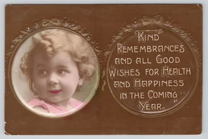 Postal RPPC teñida a mano en relieve niña retrato en la cabeza en Año Nuevo - Imagen 1 de 2