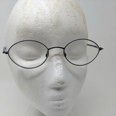 Gafas ovaladas de metal negro/azul oscuro Steeling Kenneth Cole para mujer Foto 1 de 4