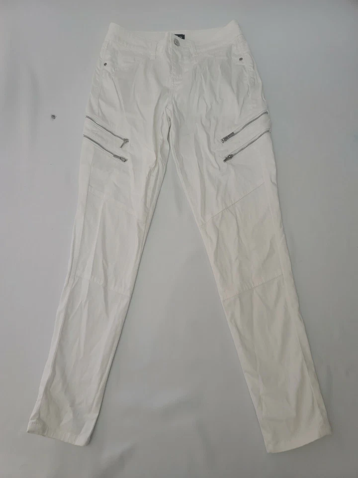 Pantalones ajustados blancos BEBE 26 para mujer con cremalleras delanteras usados en excelente estado  Foto 1 de 4