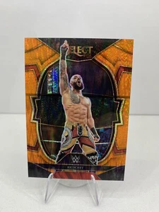2023 Panini Select WWE Ricochet Concourse Orange Flash #34 - Bild 1 von 2
