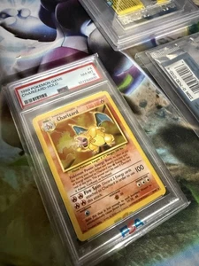 1999 WOTC POKEMON BASE SET UNLIMITED CHARIZARD 4/102 HOLO RARE PSA 8 NM-MT - Bild 1 von 2