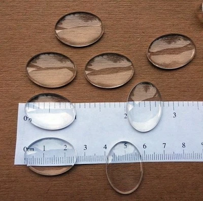Cabujones de vidrio transparente cúpula ovalada 18 mm x 25 mm (0,7" x 0,98") aumento cabinas traseras planas Foto 1 de 2