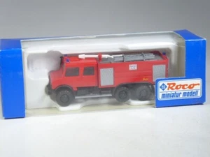 (YG-19) Roco 1699 Unimog U 2450 3 assi Ziegler vigili del fuoco TLF 28/48-5 in confezione originale - Foto 1 di 1