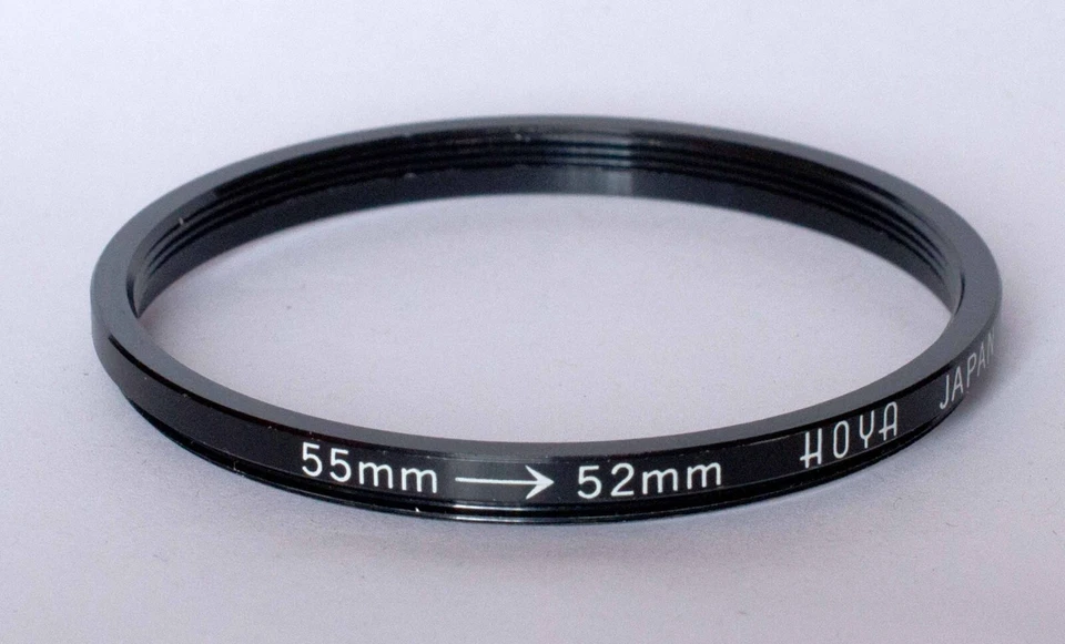 Hoya 55-52mm step down ring. - Image 1 of 1