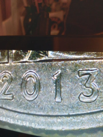 2013-D South Dakota Quarter With Die Cut Around Most Of Coin On Obverse Cover