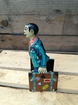 TIN TOY MAN WITH LUGGAGE EARLY CENTURY PAYA - Image 1 of 2
