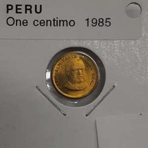 1985 Peru 1 Centimo Brass Coin Commemorating Admiral Grau UNC/Toning - Picture 1 of 2