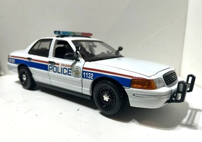 1/18 SCALE CUSTOM CALGARY CANADA POLICE DIECAST FORD  W WORKING LIGHTS - Image 1 of 4