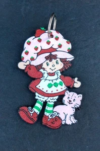 Portachiavi borsa glitter plastica piatta torta corta fragola e crema pasticcera ciondolo - Foto 1 di 4