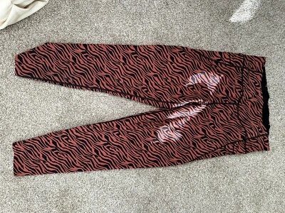 Victoria Secret 黑色和橙色斑马印花打底裤,尺寸 M — 第 1/4 张图片