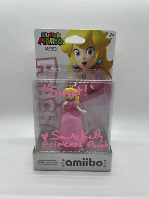 Подписанная САМАНТА КЕЛЛИ ПРИНЦЕССА ПЕРСИКОВАЯ Amiibo Nintendo Super Mario сертификат подлинности JSA - Изображение 1 из 4