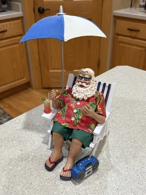 RARE BEACH THEMED SANTA CLAUS W/BEACH CHAIR AND UMBRELLA, Cocktail And STEREO - Image 1 of 4