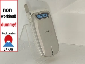 【Factice !】 KYOCERA A1012KII (couleur argent) au-japon téléphone portable qui ne fonctionne pas - Photo 1 sur 3