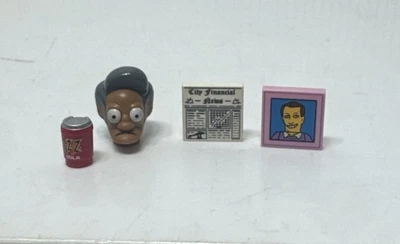 Lego Simpsons Minifigure And Parts - Buzz Cola, Newspaper, Apu Head, And A Pic - Image 1 of 3