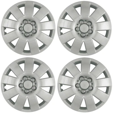 NUEVO 2003-2004 Toyota Corolla 15" 9 radios tapacubos cubierta de rueda plateado juego de 4 Foto 1 de 2