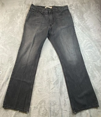 Pantalones de mezclilla negros tiro bajo Levi's 527 Bootcut 36x34 para hombre Foto 1 de 4