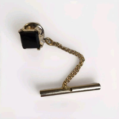 Pin de Solapa Tie Tac con Cadena Tono Dorado o Tono Latón con Piedra Negra De Colección  Foto 1 de 4
