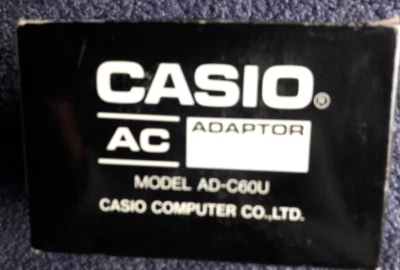 GENUINE CASIO AC ADAPTOR, AD-C60U, INPUT AC120V,NEW, ORIGINAL PACK - Image 1 of 2