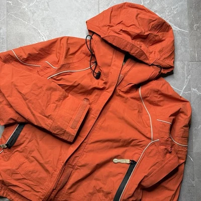 Chaqueta para mujer REI Elements E1 pequeña naranja negra impermeable con capucha carcasa para lluvia Foto 1 de 4