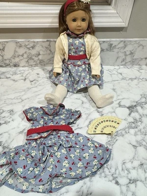 Discontinued American Girl doll emily with additional outfit and fan . - Image 1 of 4