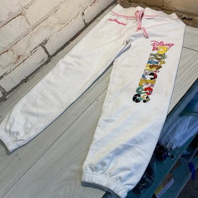 Pantalones blancos pequeños de princesa juvenil de los parques de Disney - pantalones deportivos blancos para jóvenes Foto 1 de 4