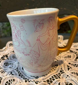 DISNEY ~ TAZZA CERAMICA ROSA SCHIZZO PRINCIPESSE PIEDI CON MANICO ORO ~ - Foto 1 di 8