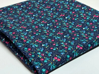 Navy fabric w/pink, blue, and green flowers, little white dots, 3/4ydsxWOF - Image 1 of 4