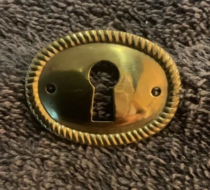 Oval STAMPED Antiqued BRASS  ESCUTCHEON / KEY HOLE COVER - Picture 1 of 3
