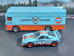 1/64 diecast Hot Wheels Premium Team Transport Lancia 037 and Euro Hauler Gulf - Picture 1 of 3