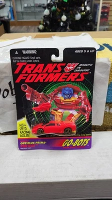 NIB 1994 OPTIMUS PRIME FERRARI RED CAR GO-BOTS TRANSFORMERS AUTOBOT HASBRO 1/64 - Image 1 of 4