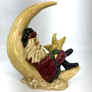 Arte popular vintage 1994 Ila Lefever Enesco Santa descansando en la luna sosteniendo estrella - Imagen 1 de 15