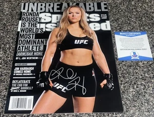 ROWDY RONDA ROUSEY SIGNED SPORTS ILLUSTRATED SI BAS AUTOGRAPH WWE UFC BECKETT - Picture 1 of 2