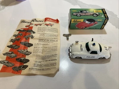Schuco Micro Racer 1047 Porsche Police con caja y llave Foto 1 de 3