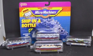 Lot of 4 Micro Machines Ship in a Bottle – Titanic – PT Boat – Troop ship - Picture 1 of 5